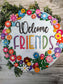 Bright 3D floral wreath welcome door hanger or wall sign.